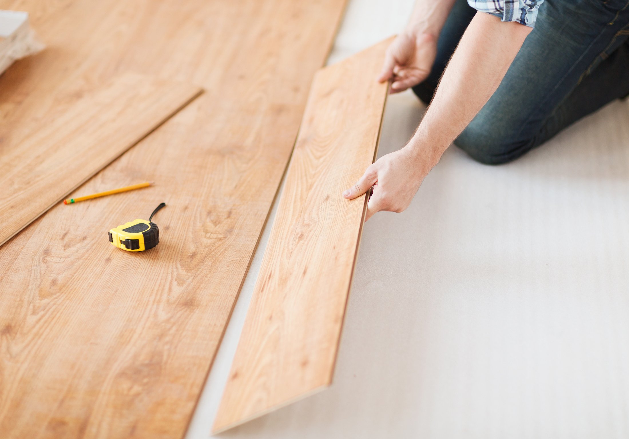 Male Hands Installing Wood Flooring